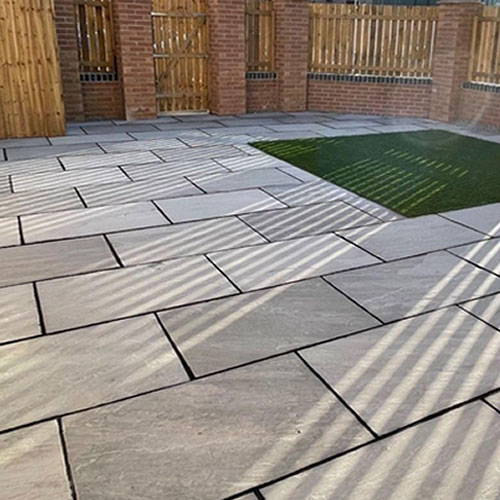 Image of man made Paving Alabs and artificial grass  in Newcastle upon Tyne, the way the sun glistens of the Paving is a joy to see 